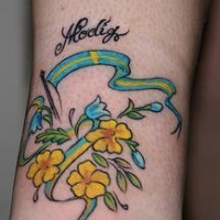 Flag and flowers coloured tattoo