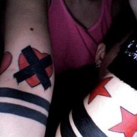 Simple black and red wrist tattoo