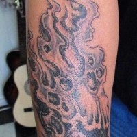 Black, awful, flying flaming skull forearm tattoo