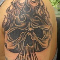 Flaming skull of spades tattoo