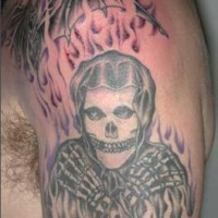 Misfits skeleton in flame tattoo