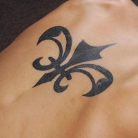 Tribal fleur de lis tattoo on back