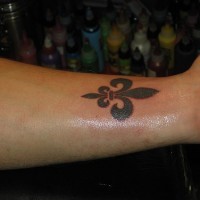 Fleur de lis wrist tattoo
