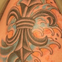 Fleur de lis in sea waves tattoo