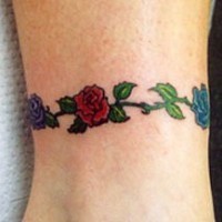 Colourful flower armband tattoo