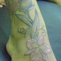 Big colourful orchids with bud foot tattoo