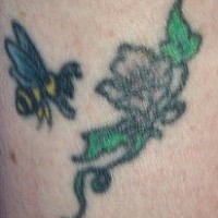 Bee on flower tattoo in colour