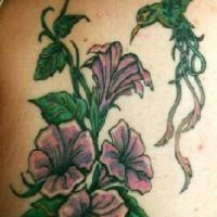 Purple flowers and green humminbird tattoo