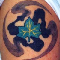 Blue leaf on water paint tattoo