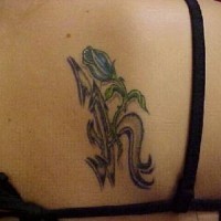 Flower as monogram tattoo
