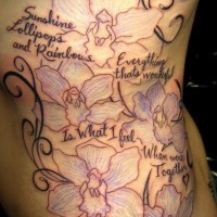 Flowers and kid names on it tattoo