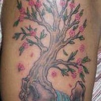 Tree tattoo with pink flowers and stream