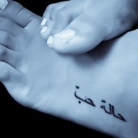 Black foreign words accurate  foot tattoo