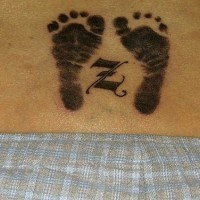 Footprint lower back tattoo, black designed images