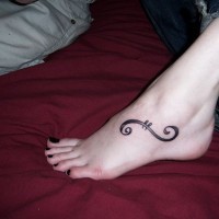 Accurate black curl like moustache foot tattoo