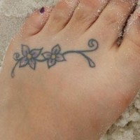 Thin curled branch with two flowers foot tattoo