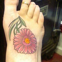 Pink flower with many petals foot tattoo