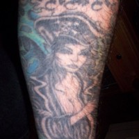 Beautiful pirate woman, styled name forearm tattoo