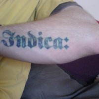 Indica, special styled inscription forearm tattoo