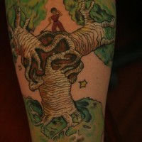 Boy staying on large shaken tree forearm tattoo