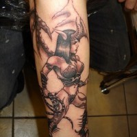 Cruel horned woman with whip forearm tattoo