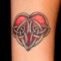 Red heart with links forearm tattoo