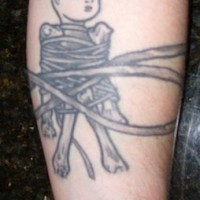 Little boy tightly  tied with twines forearm tattoo