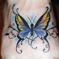 Yellow butterfly tattoo on foot