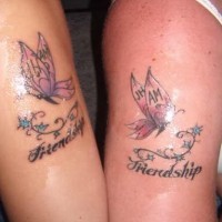 Identical butterfly tattoos with friendship