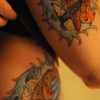 Identical koi with rice tattoos on friends