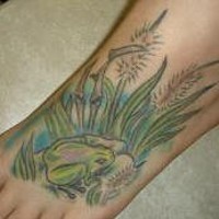 Green frog on swamp tattoo