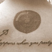 Funny tattoo on back