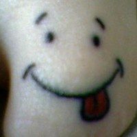 Funny face toe tattoo