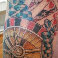 Roulette wheel with royal flush of hearts tattoo