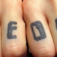 Knuckle tattoo,game over, big black letters