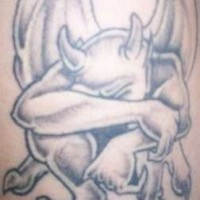Sad gargoyle in sorrow tattoo