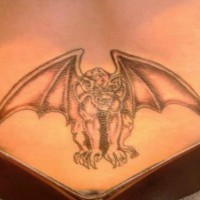 Gargoyle lower back tattoo