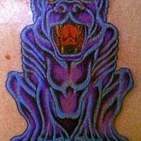 Purple gargoyle with dog head tattoo