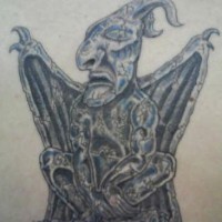 Tribal gargoyle sculpture tattoo