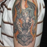 Gargoyle with goat head in flames on arm