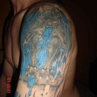 Gargoyle throwing blue fire tattoo