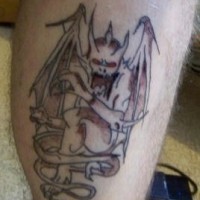 Bloody gargoyle tattoo on leg