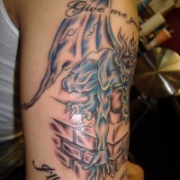 Gargoyle on chimney with writings tattoo