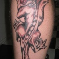 Gargoyle creature tattoo on leg