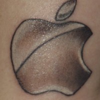 Silver apple logo tattoo