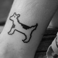 Eight bit style dog tattoo on hand