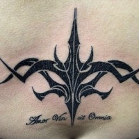 Black tribal tracery on lower back
