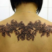 Mythical tracery tattoo on back