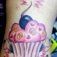 Girly deathful cupcake tattoo