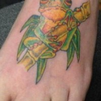 Green frog on bamboo tattoo